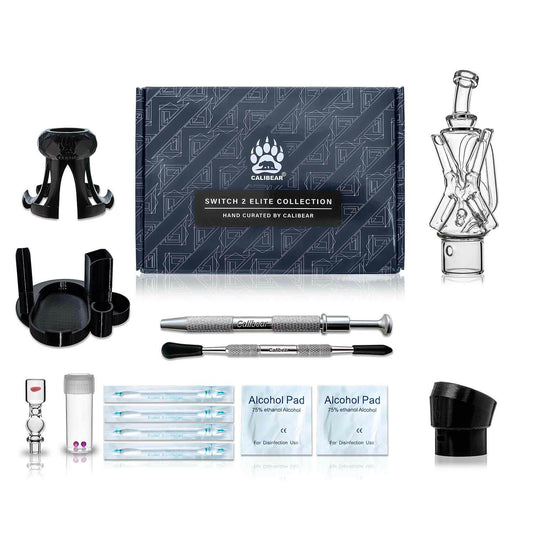 Calibear Switch 2 Ultimate Upgrade Crate — premium open combo box showing Calibear Xfinity Recycler Glass, Opal Pillar Joystick Carb Cap, 2 Ruby Terp Pearls, Switch 2 Base Tray, 3D Printed Puffco Peak adapter, Glass Holder, Pearl Claw, dab tool, and alcoh