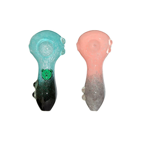 Two Calibear dual-tone glass spoon pipes in teal-black and pink-grey with marble feet stabilizers and green bear logo.