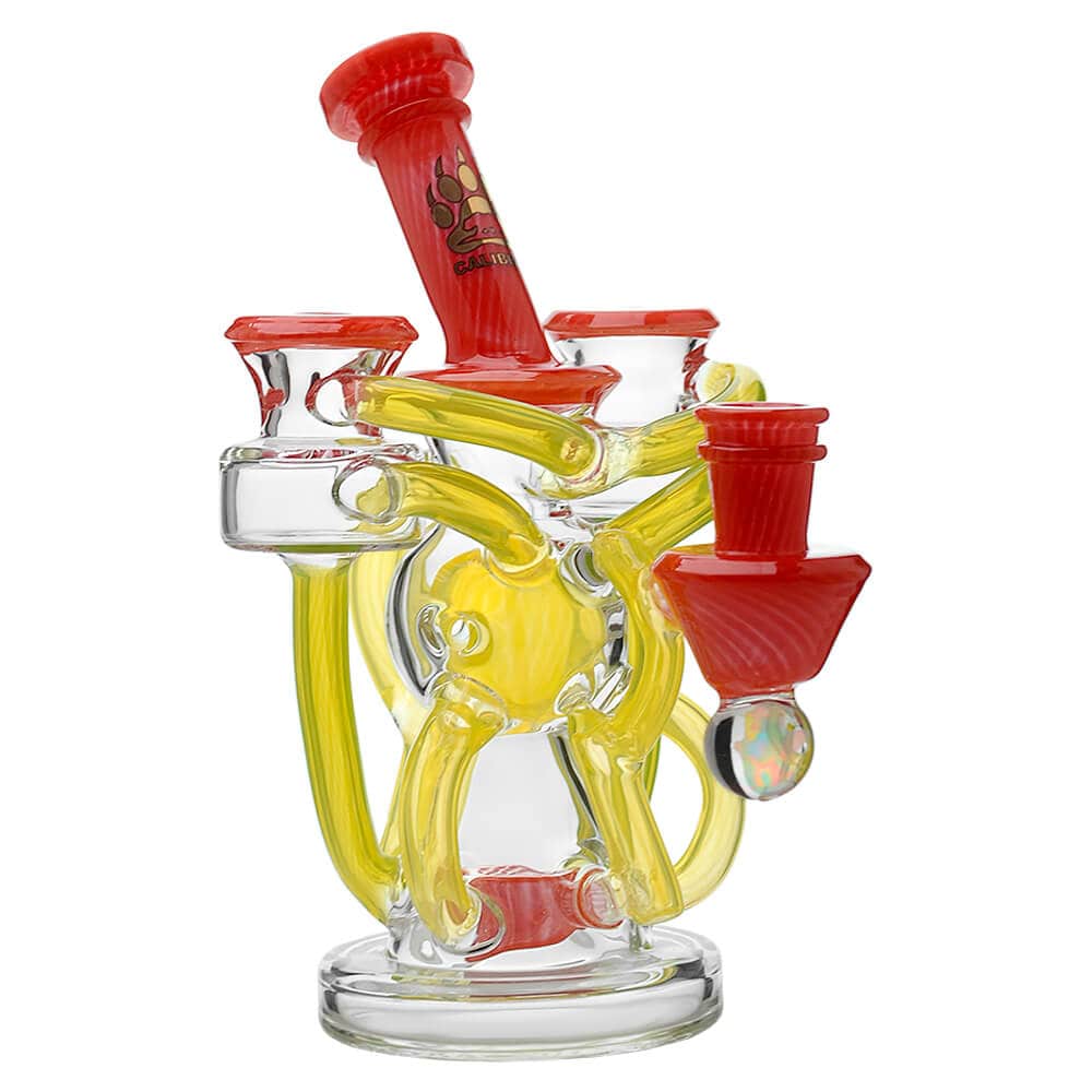 Calibear artistic recycler dab rig with encased opal and colorful multi-chamber borosilicate glass recycler design.