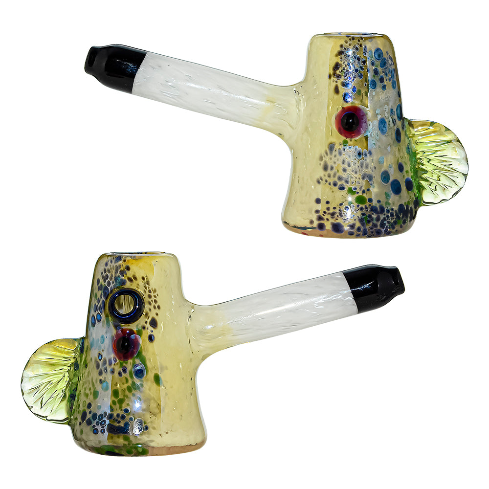 CaliBear Glass Puffer Fish hand pipe featuring a yellow-green speckled body, large eyes, and a white stem with black mouthpiece on a white background.