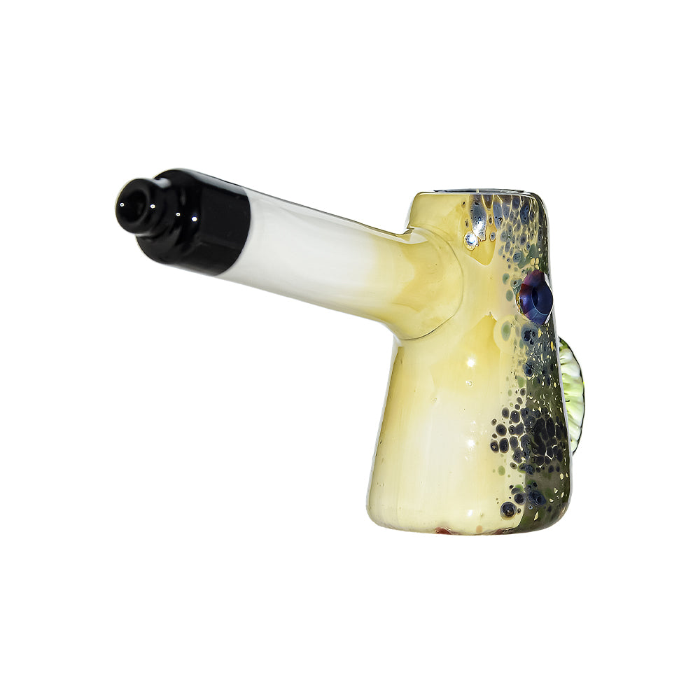 CaliBear Glass Puffer Fish hand pipe featuring a yellow-green speckled body, large eyes, and a white stem with black mouthpiece on a white background.
