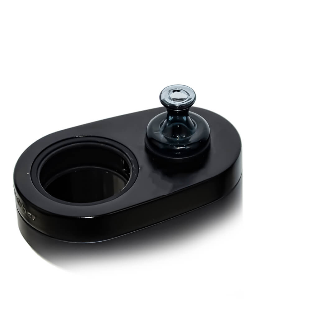 Calibear Classic Speaker Vortex Spinner Cap (Transparent Black) fitted into a black device base, showing its flared glass opening and compact seated design