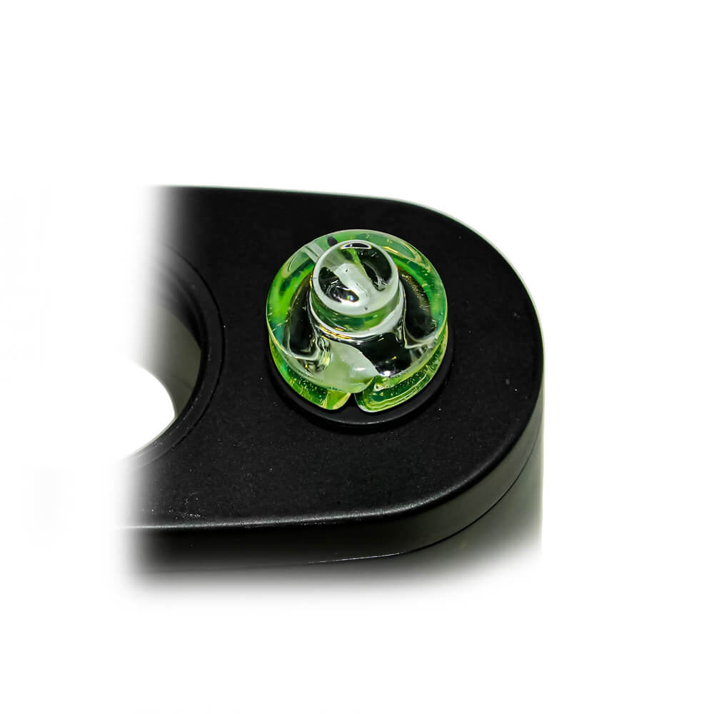 Calibear Premium Spinner Carb Cap (Lime Candy), top-down close-up showing the glass opening and spiral airflow channels while installed on a compatible device