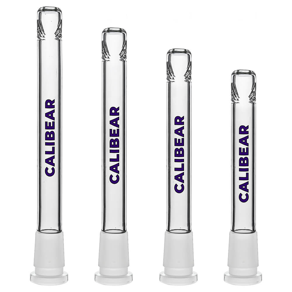 Four clear glass Calibear Premium Tri-Seed Slotted Ice Pinch Downstems in varying lengths, showcasing the unique triangular ice pinch restriction at the tip and clear embossed side logos.
