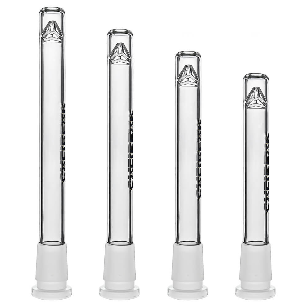 Four clear glass Calibear Premium Tri-Seed Slotted Ice Pinch Downstems in varying lengths, showcasing the unique triangular ice pinch restriction at the tip and clear embossed side logos.
