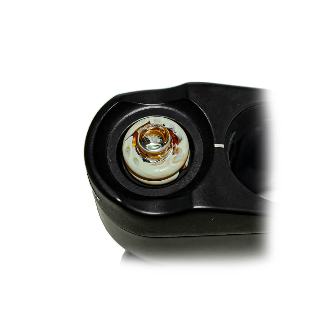 Calibear Spinner Carb Cap (toffee brown) installed on a compatible atomizer, close-up top view showing the circular glass opening, spiral airflow design and decorative amber accents