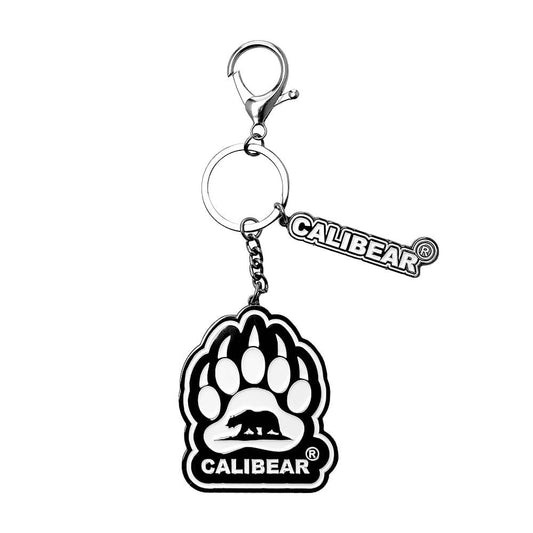 Five Calibear collectible streetwear bear keychain figurines in black, green, blue, purple, and red alongside a premium black and silver metal Calibear bear paw logo keychain.