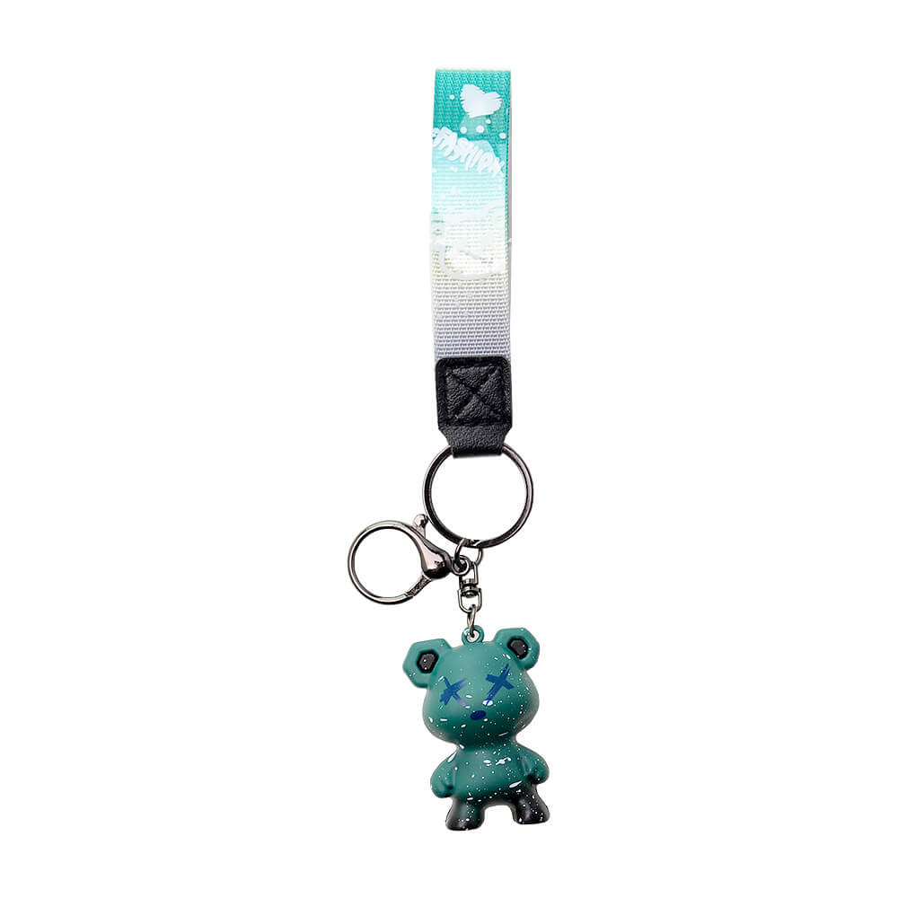 Five Calibear collectible streetwear bear keychain figurines in black, green, blue, purple, and red alongside a premium black and silver metal Calibear bear paw logo keychain.