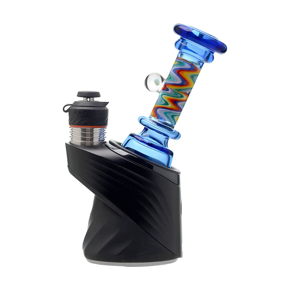 A collection of CaliBear glass attachments for Puffco Peak OG and Pro featuring vibrant wigwag swirl patterns in multiple colors and encased opal accents.