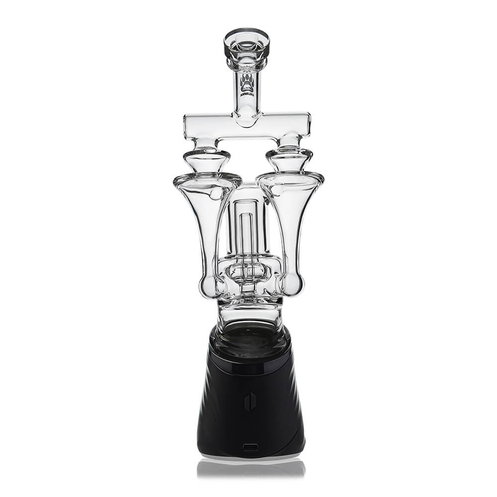 Calibear Premium DUO RBR Recycler clear glass attachment featuring a dual-drain external recycling system and angled neck, shown standalone and docked on a Puffco Peak Pro.