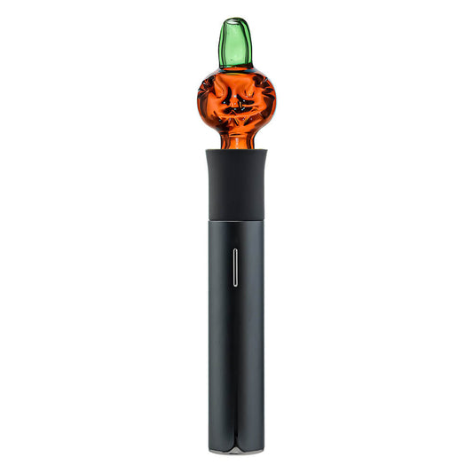 Two orange Pumpkin Jack glass attachments for the Pivot device featuring carved face details and green stem mouthpieces on a white background.