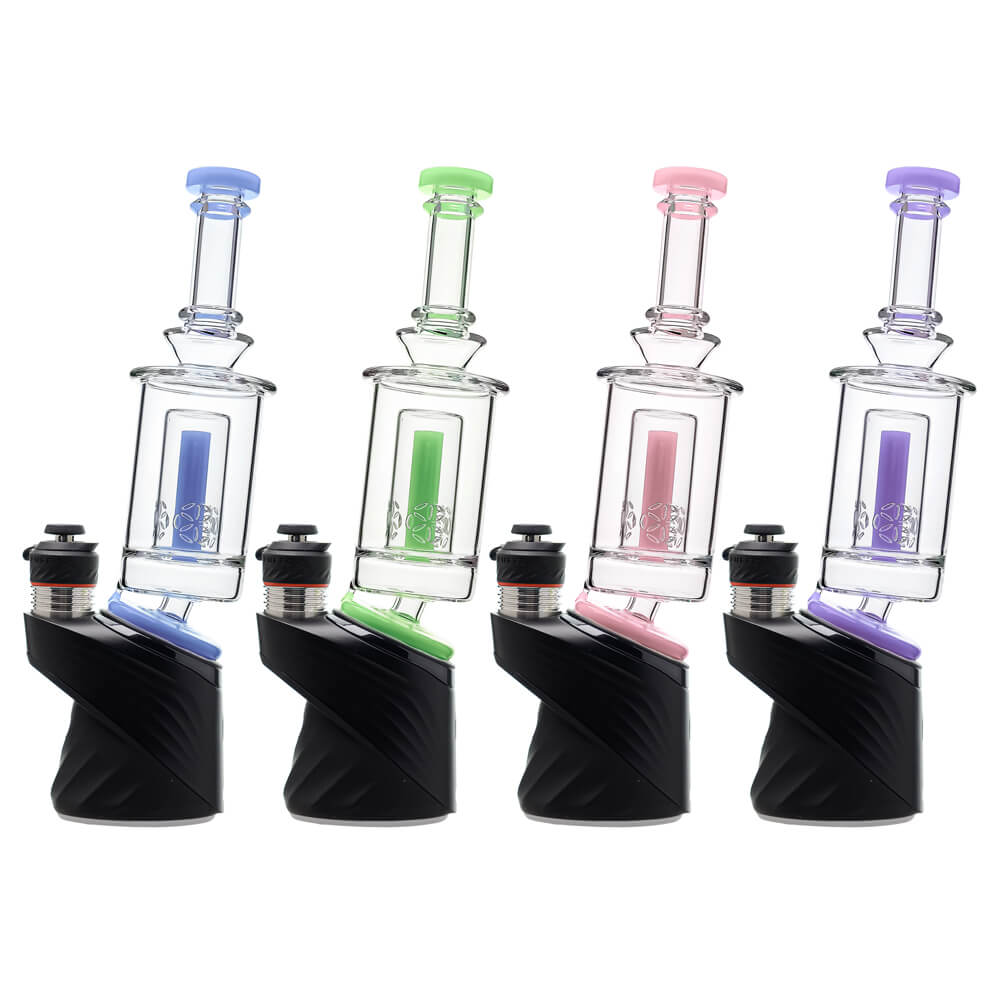 Four Calibear SOL Seed of Life Puffco Peak Glass Attachments mounted on black Puffco Peak devices — featuring clear borosilicate rectangular chamber with colored central stem insert in blue, green, pink, and purple, Seed of Life etched percolator disc, straight tube mouthpiece with colored disc cap, and colored base adapter ring, shown in a row against white background.