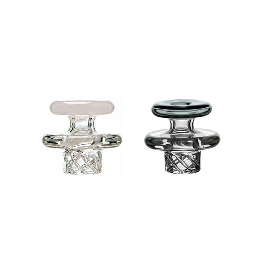 Two Calibear Universal Vortex Spinner Carb Caps, featuring one clear glass option and one smoked grey glass option, showcasing the precision spiral airflow grooves on the bottom stem and a wide sealing ridge.