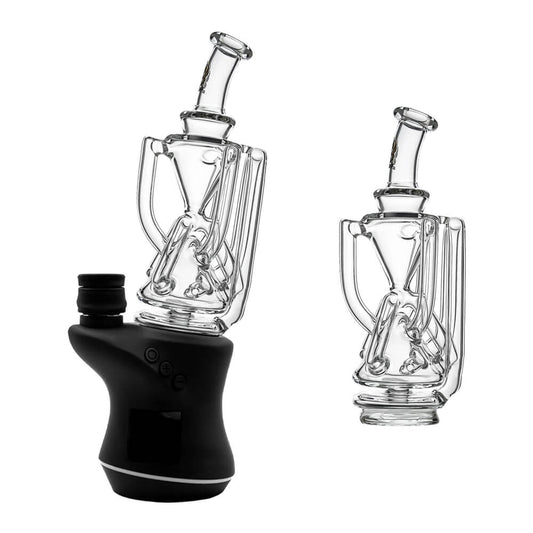 Clear glass Tri-Cycler glass attachment for Focus V Carta e-rig shown mounted on device and standalone showcasing the hourglass chamber and external recycling tubes.
