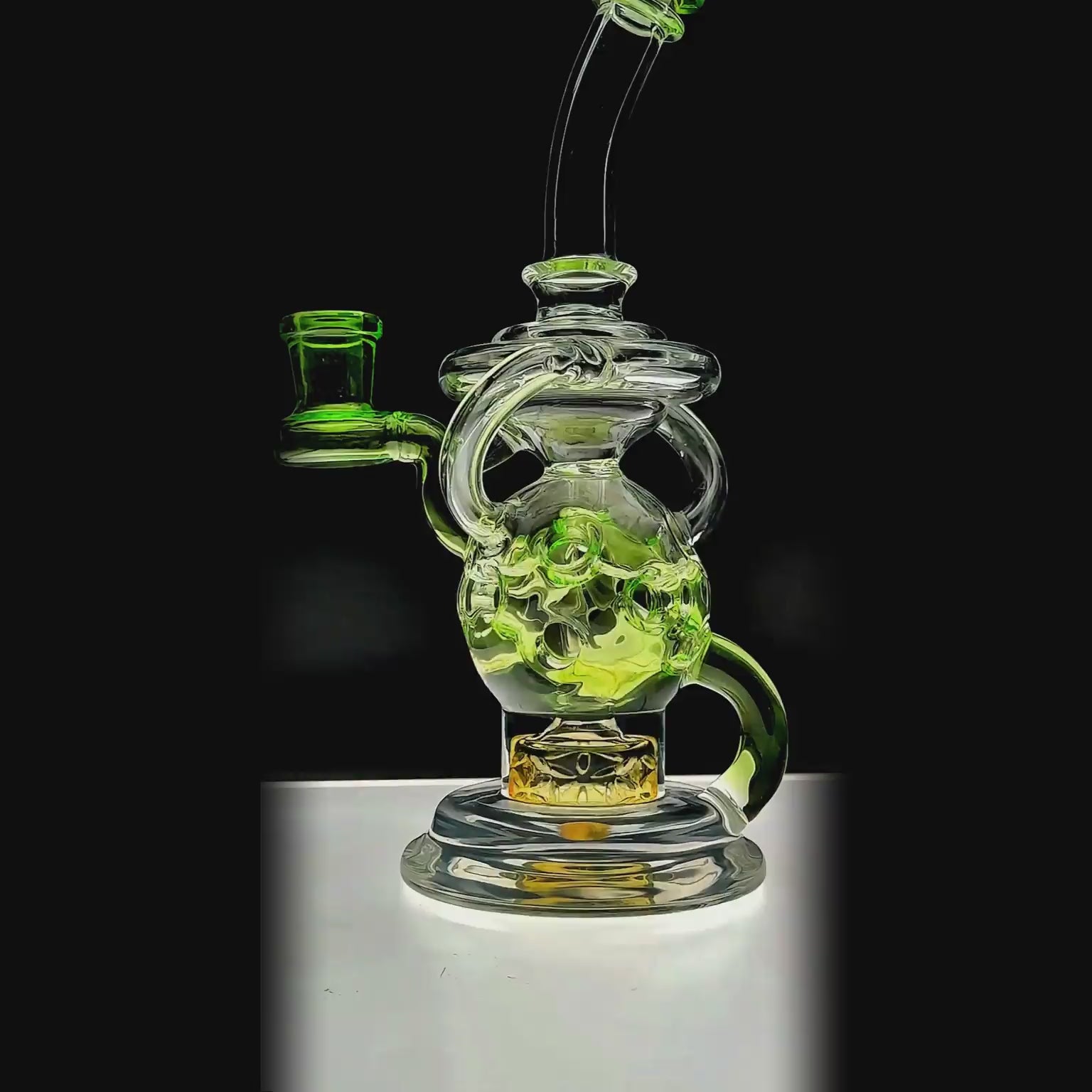 Calibear Fab Sphere Dab Rig in lime green function video — featuring a clear borosilicate spherical fab chamber with green honeycomb bubble accents, triple Seed of Life percolator base, internal vortex can, torus-style recycler ring, curved green downstem with green bowl, angled clear neck with green disc mouthpiece cap, side handle loop, and flat square base with embossed Calibear logo, standing 8 inches tall with a 14.5mm female joint.