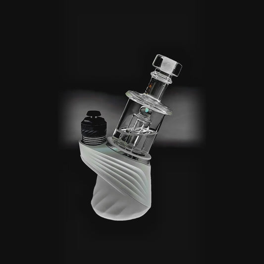 function video of Calibear Classic Opal Tube Bubbler Glass Attachment (Clear) installed on Puffco Peak OG & Pro, showing cylindrical chamber and internal tube filtration