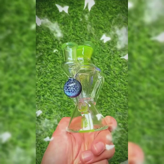 CALIBEAR HOUR GLASS DOUBLE LAYER RECYCLER WITH GILDED TUBES ENCASED WITH MABLE - Premium borosilicate glass dab rig from Calibear Glass. Ideal for dabbing, providing smooth hits and durability. Shop high-quality dab rigs, water pipes, bongs, erig glasses and glass smoking accessories at Calibear Glass. Elevate your smoking experience with a durable and stylish glass dab rig. Free shipping on all orders.