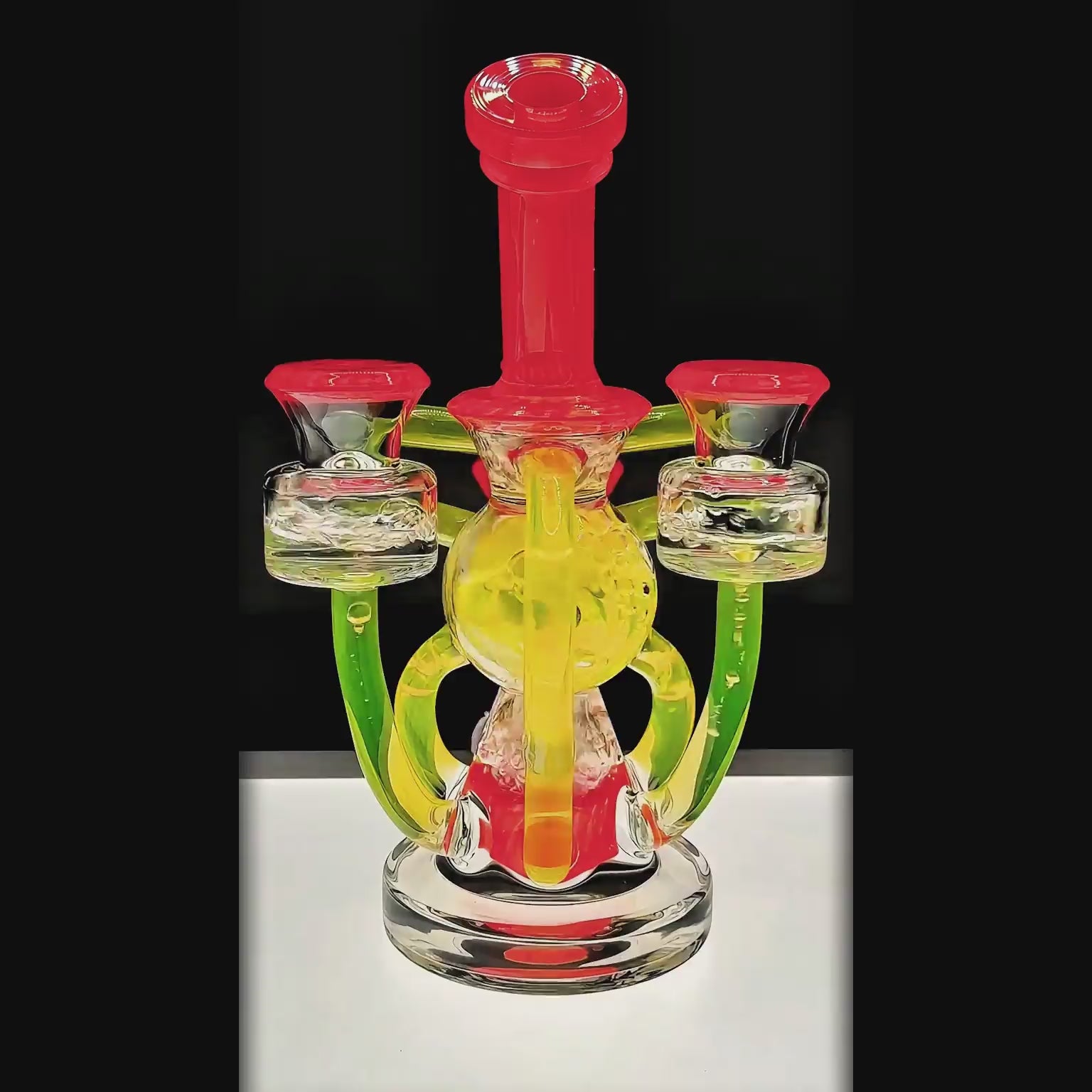 Calibear artistic recycler dab rig with encased opal and colorful multi-chamber borosilicate glass recycler function video.