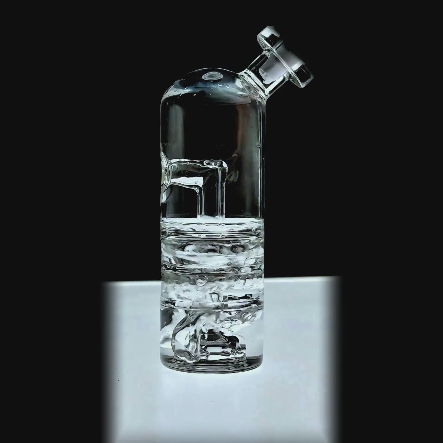 function video of Calibear Triple Splash Guard Glass Bubbler (Clear) for Dr. Dabber Switch Go, installed side view with angled mouthpiece and water filtration chamber