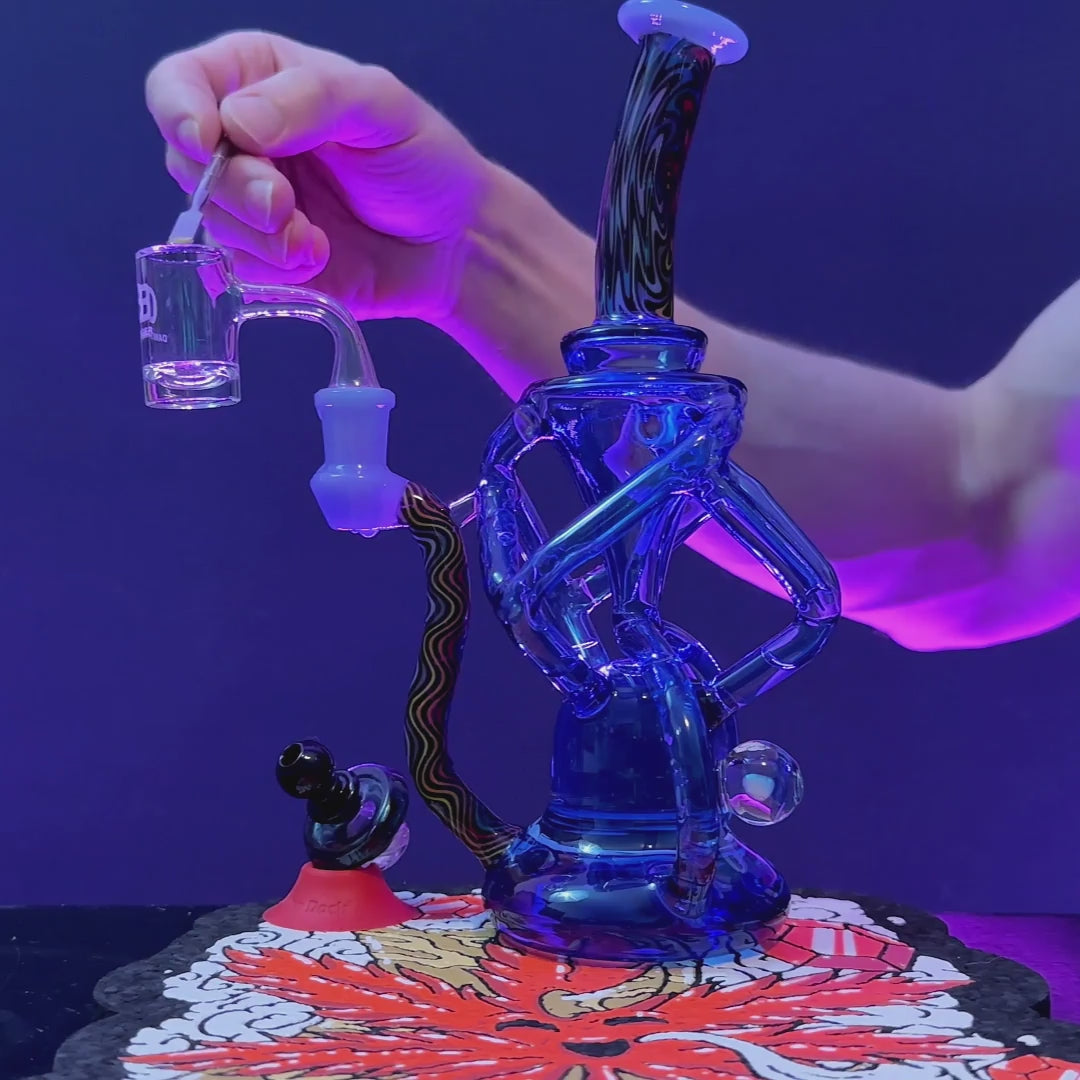 QUAD WIGWAG RECYCLER WITH OPAL- Premium borosilicate glass dab rig from Calibear Glass. Ideal for dabbing, providing smooth hits and durability. Shop high-quality dab rigs, water pipes, bongs, erig glasses and glass smoking accessories at Calibear Glass. Elevate your smoking experience with a durable and stylish glass dab rig. Free shipping on all orders.