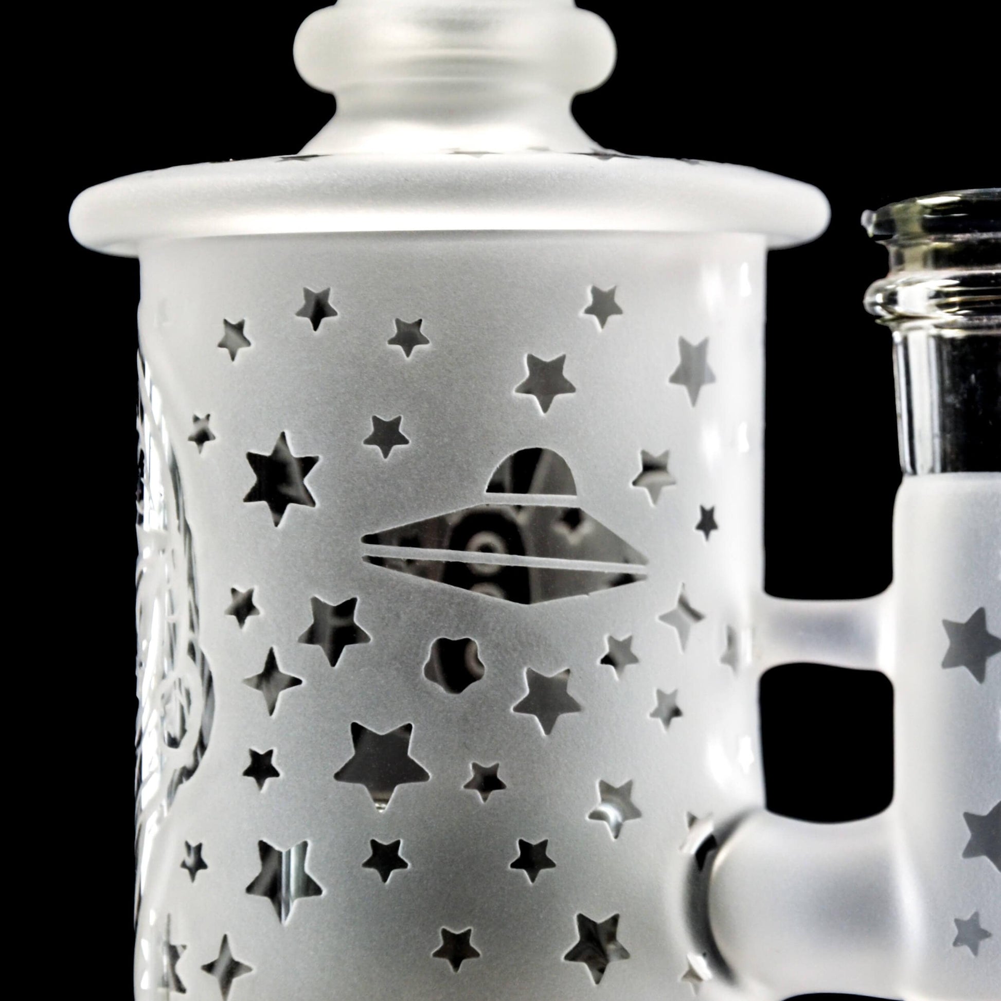 Calibear Premium frosted glass dab rig with deep sandblasted spaceship and star patterns featuring a Flower of Life percolator.